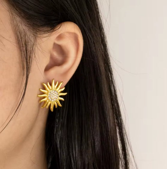 Gold-tone Sun Stud Earrings With Cubic Zirconia Stones.