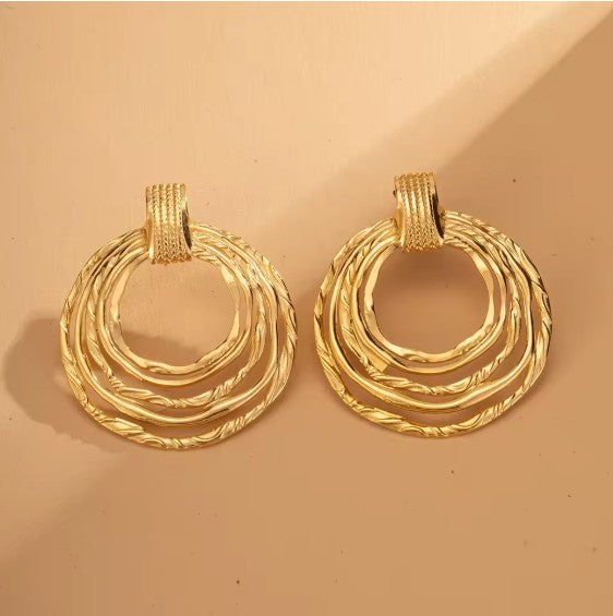 Multi-Ring Hoop Earrings With A Textured Finish.