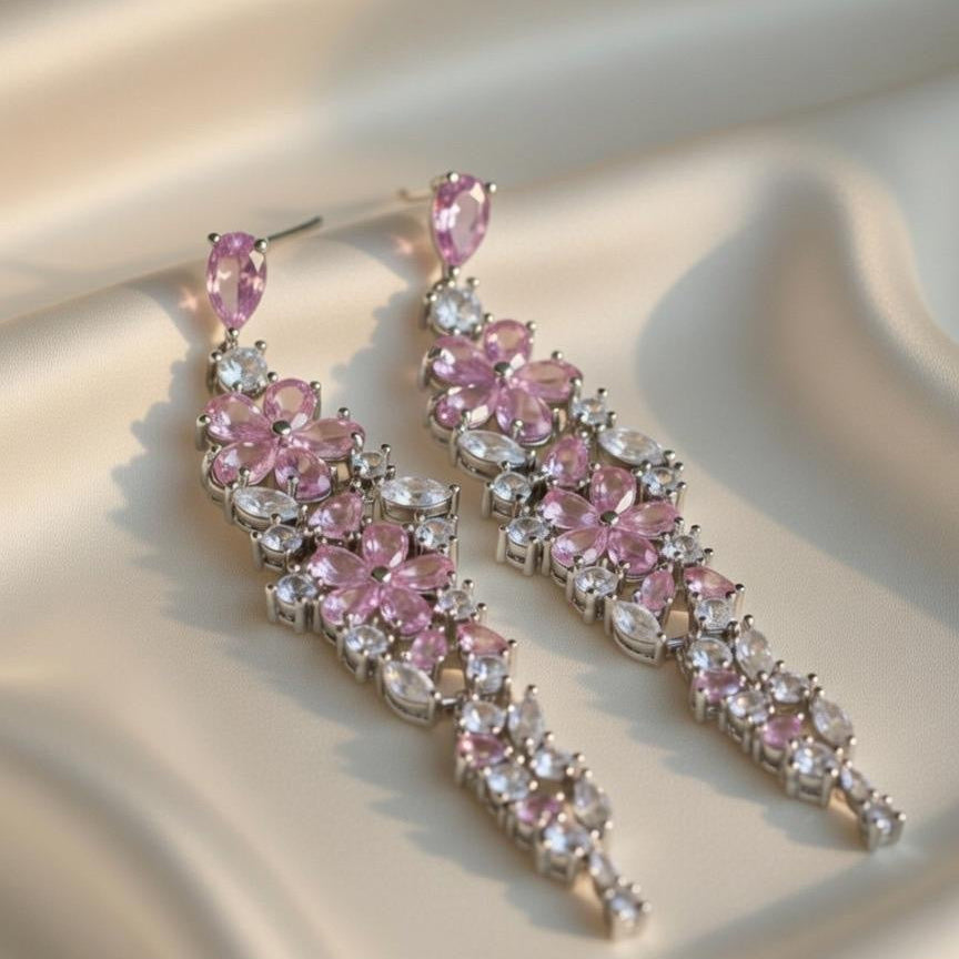 Elegant floral-inspired cascading drop earrings with white & pink cubic zirconia stones.