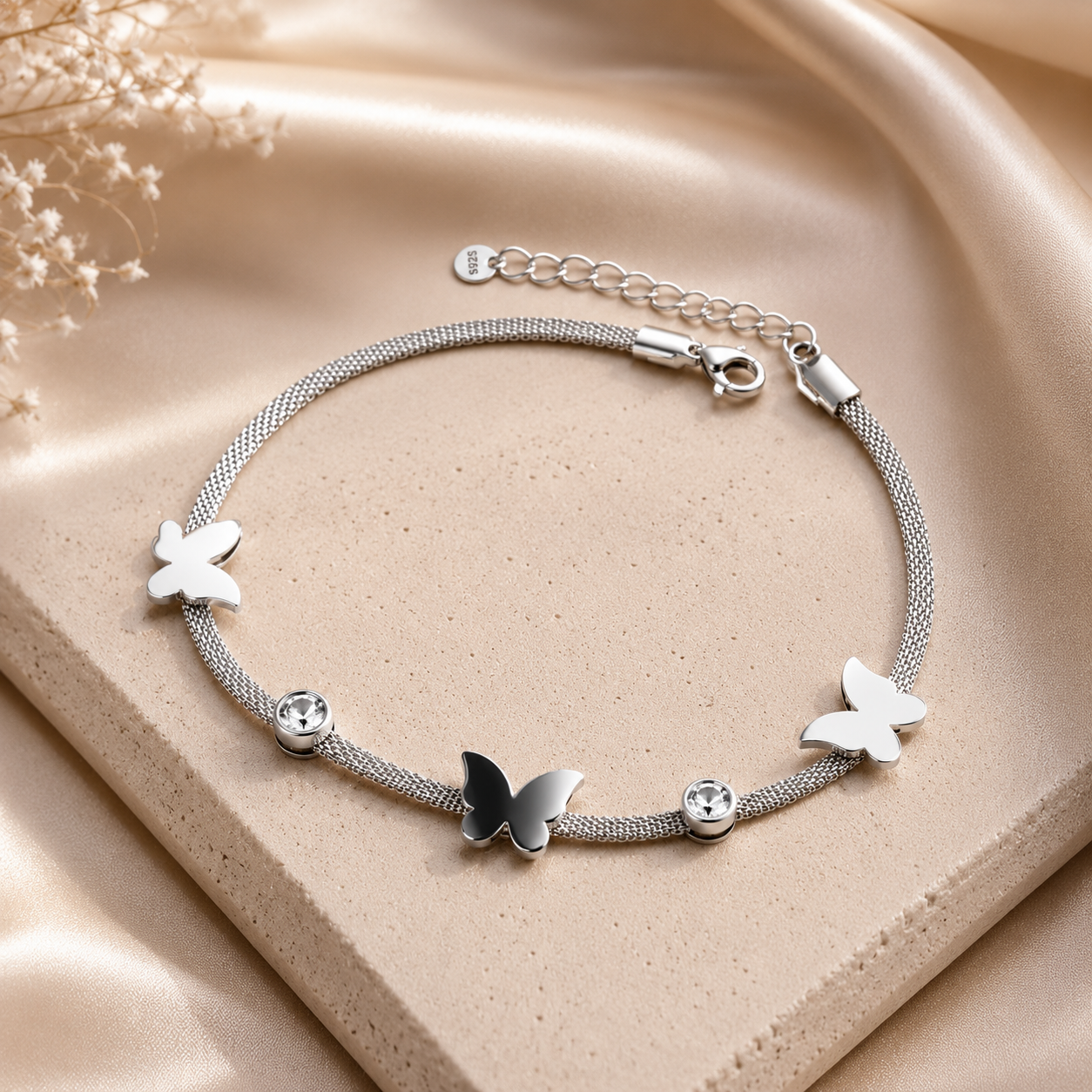 Siliver toned Stainless steel bracelet with butterfly and crystal accents