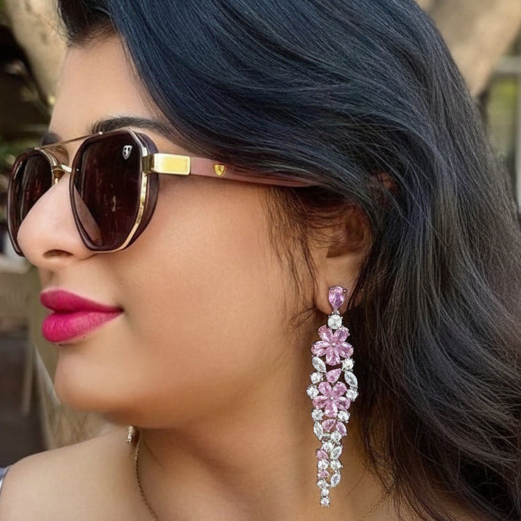 Elegant floral-inspired cascading drop earrings with white & pink cubic zirconia stones.