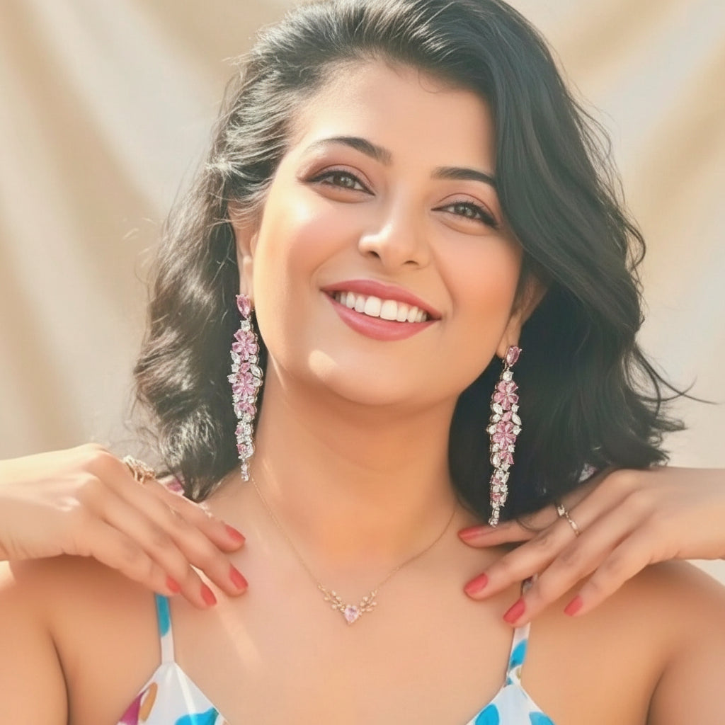 Elegant floral-inspired cascading drop earrings with white & pink cubic zirconia stones.