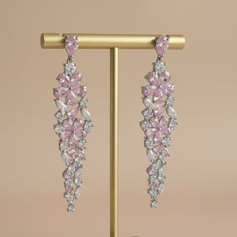 Elegant floral-inspired cascading drop earrings with white & pink cubic zirconia stones.