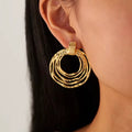 Multi-Ring Hoop Earrings With A Textured Finish.