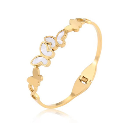 Gold plated Stainless Steel butterfly bangle bracelet with white inlay details.