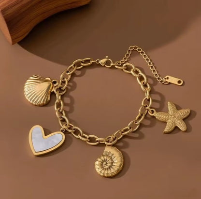 Gold plated Stainless Steel Ocean  bracelet with Starfish, Shell Conch,  and Heart charms on a cuban chain