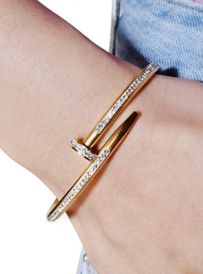 Gold plated stanless steel nail-inspired bangle bracelet with CZ stones