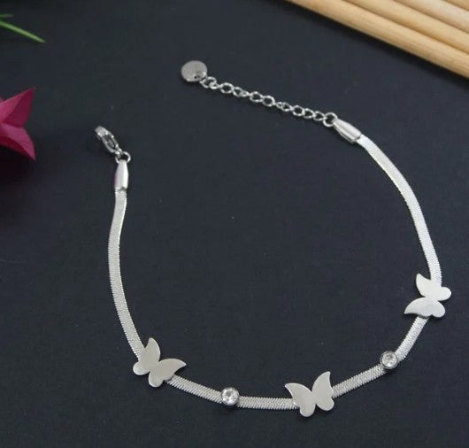 Siliver toned Stainless steel bracelet with butterfly and crystal accents