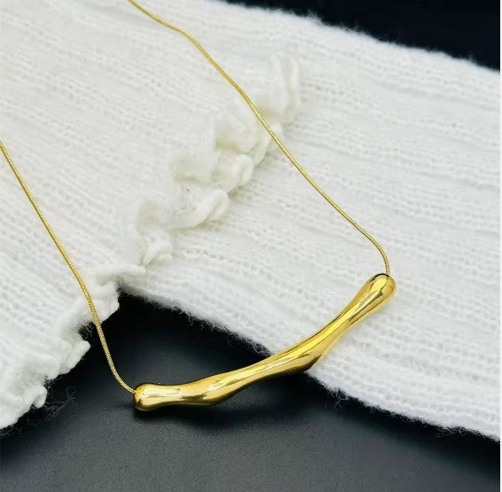Gold Plated Stainless Steel Tranish-Free Arc Chain Necklace With Irregular Bar Pendant.