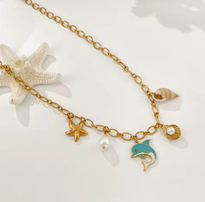 Sea-inspired Gold-tone Charm Necklace With Enamel Blue Dolphin, Starfish, Shell and Perl
