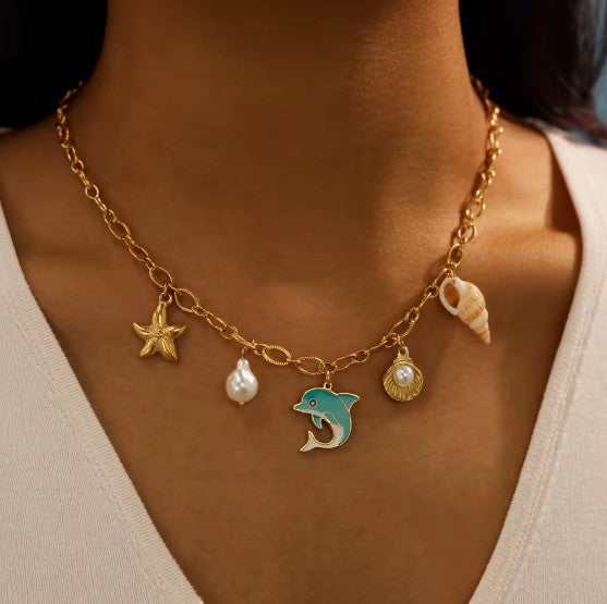 Sea-inspired Gold-tone Charm Necklace With Enamel Blue Dolphin, Starfish, Shell and Perl