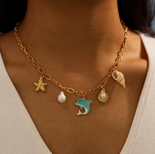 Sea-inspired Gold-tone Charm Necklace With Enamel Blue Dolphin, Starfish, Shell and Perl
