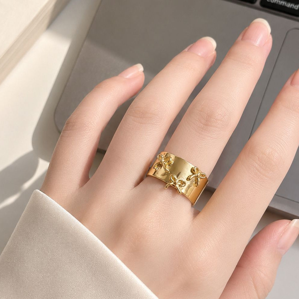 Gold Plated Adjustable Ring with Raised Bow Accents